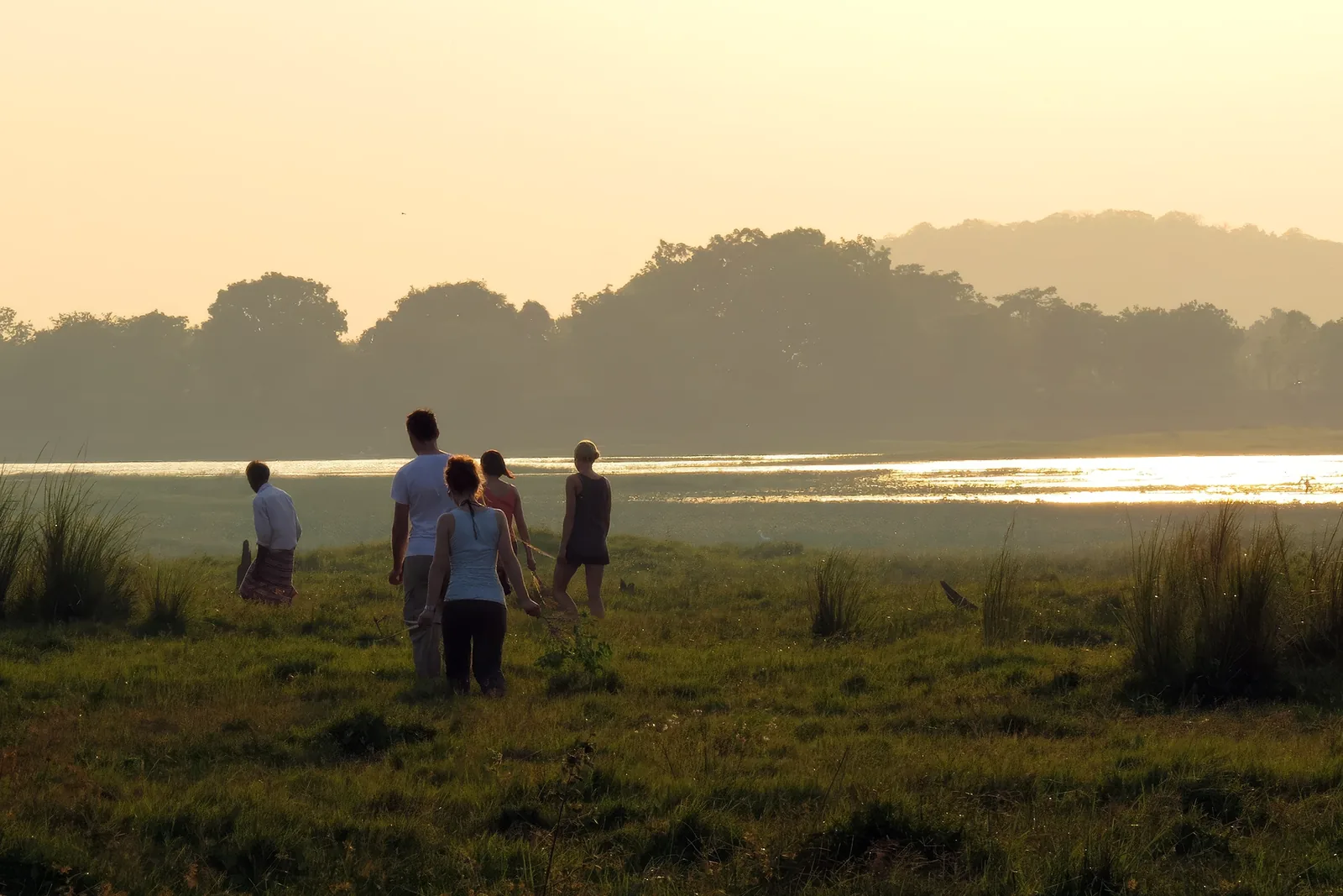 Guests walking out towards the lake at first light